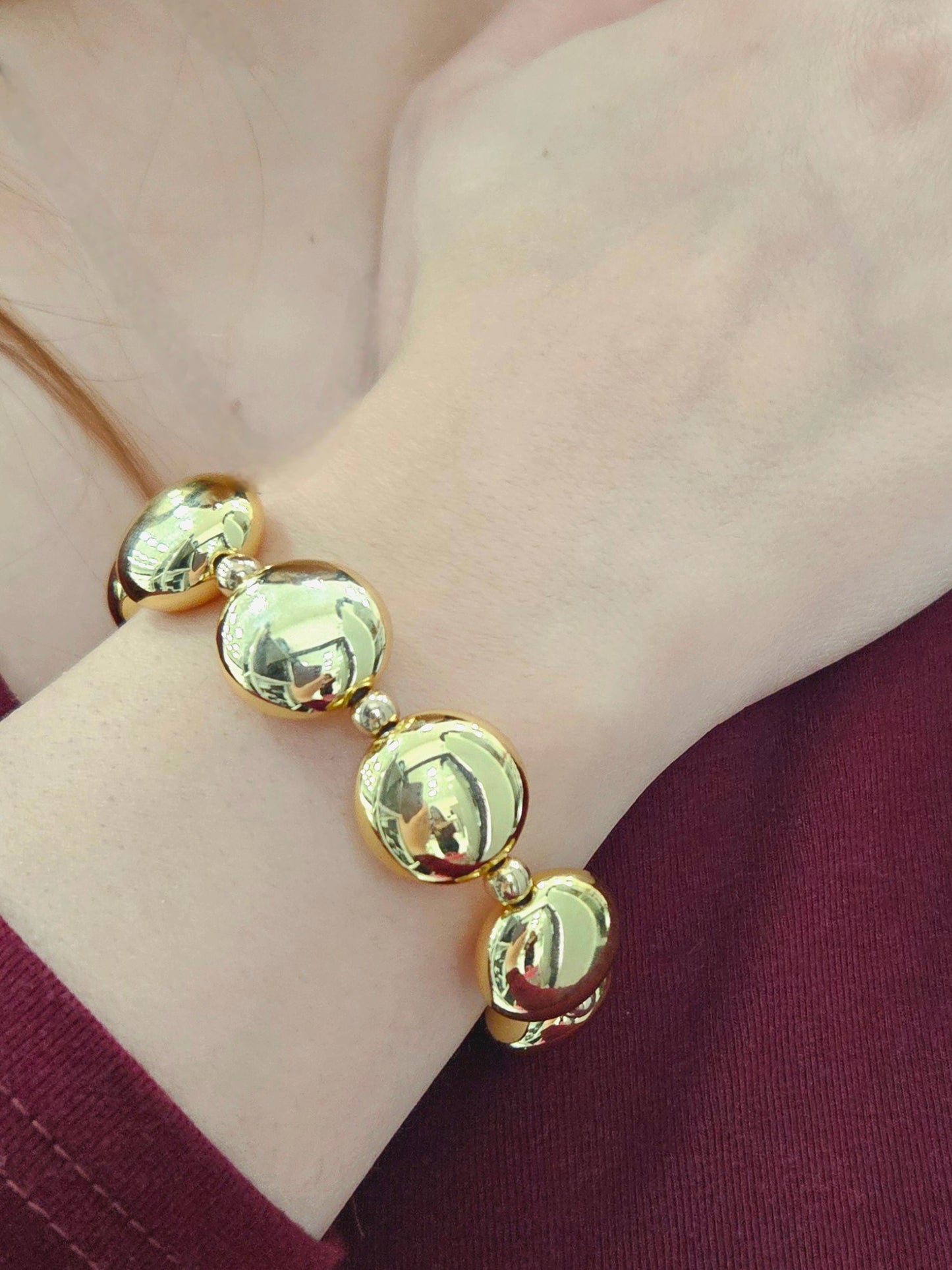 Bracciale con sfere dorato